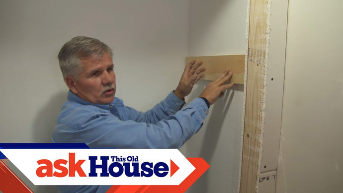 Ask This Old House general contractor Tom Silva trims a coat closet by installing a clothes rod and shelf